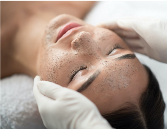 Woman having facial treatment